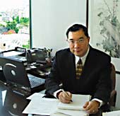 photo Jeffrey Lowe in office overlooking False Creek in Vancouver