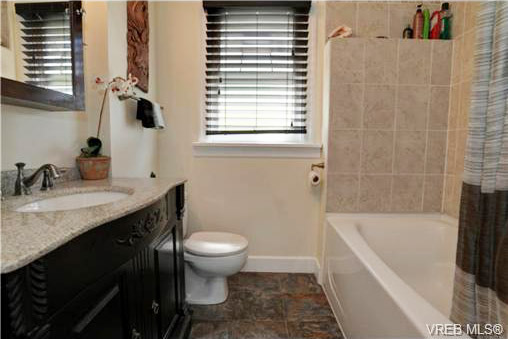 Vista Heights house renovated bathroom, note countertop, and tiles
